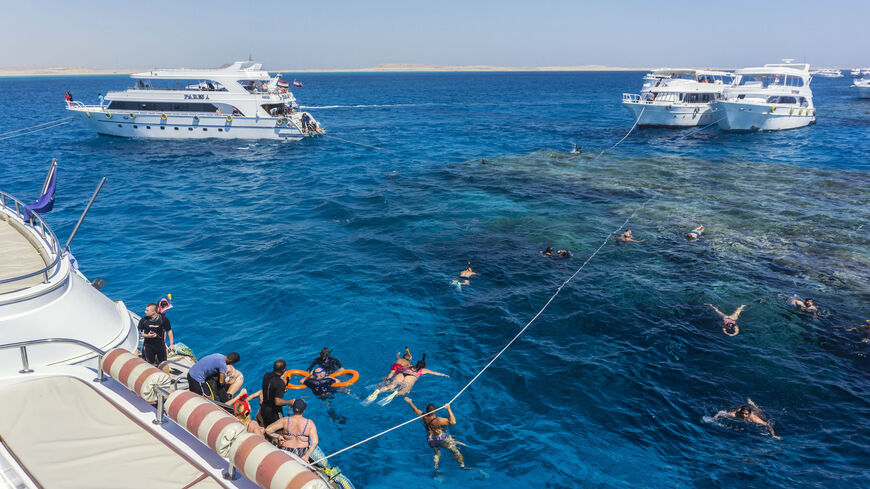 Russian tourists are seen swimming and snorkeling in the Red Sea resort of Sharm el-Sheikh, Egypt, Sept. 29, 2021.