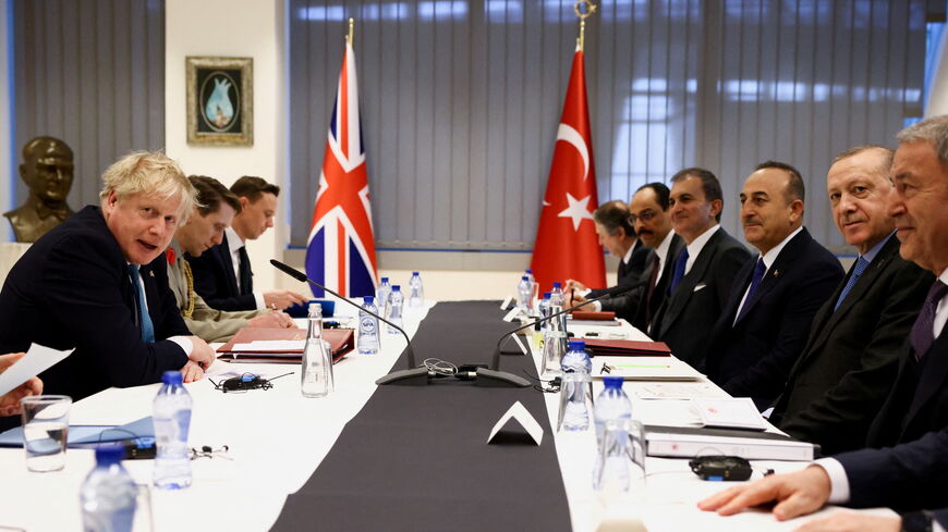 British Prime Minister Boris Johnson (L) and Turkish President Tayyip Erdogan (2R).