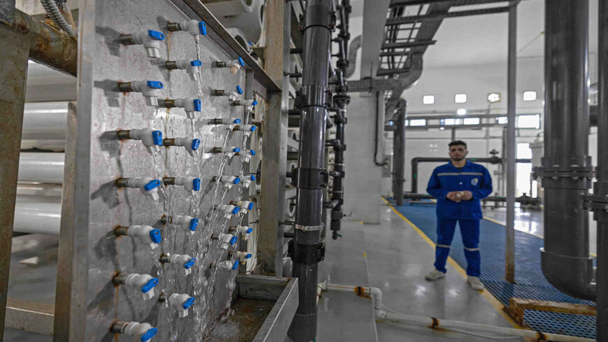 An Egyptian laborer is pictured at Al-Reesa seawater desalination plant in el-Arish city, in the northern Sinai Peninsula, March 20, 2022.