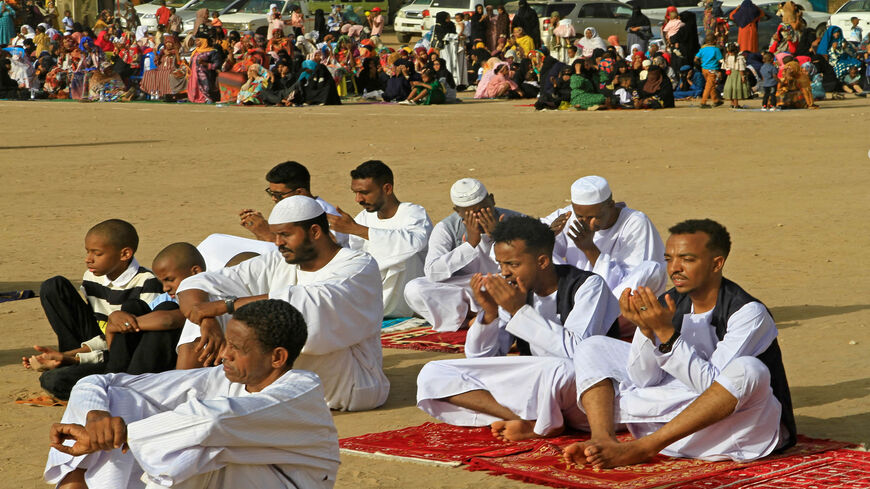 Muslim devotees pray on the first day of Eid al-Fitr, which marks the end of the holy month of Ramadan, in al-Jarif suburb, Khartoum, Sudan, May 2, 2022.