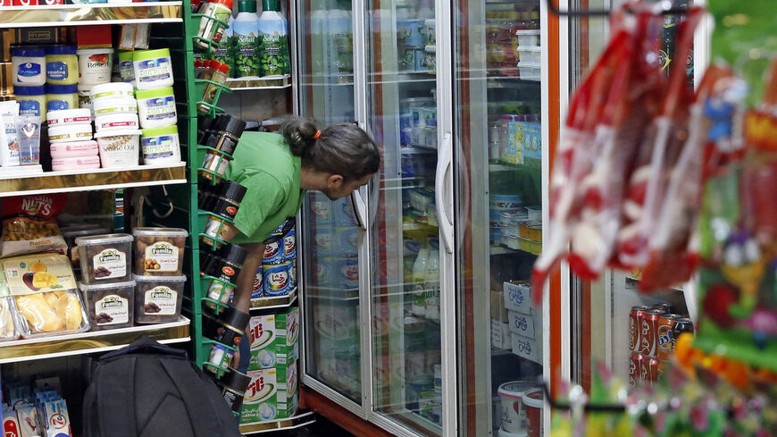 An Iranian shops at a food store in Tehran on May 13, 2021.