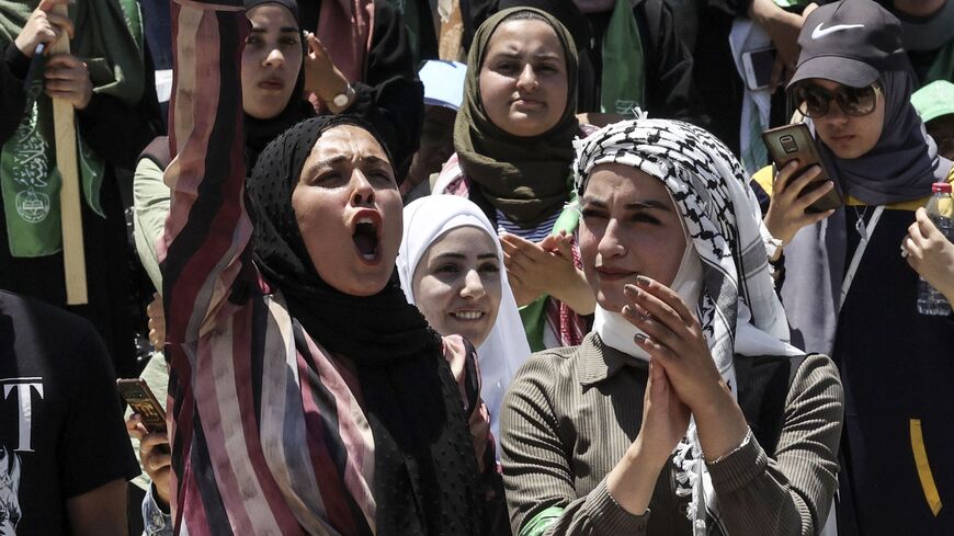 Palestinian students supporting the Islamic Hamas movement.