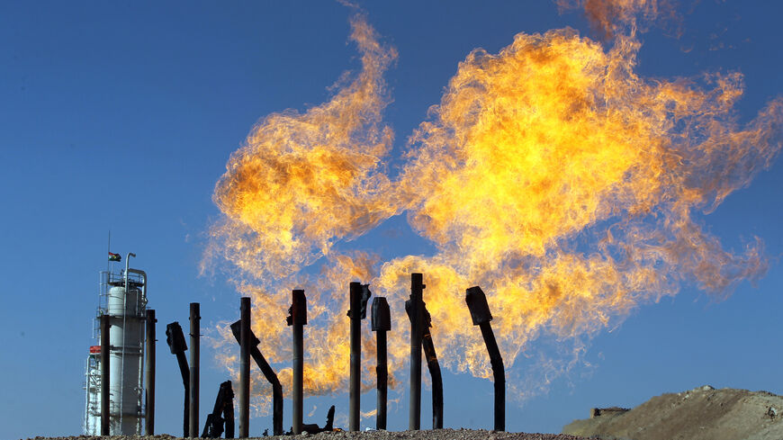 A picture taken on October 17, 2017, shows excess flammable gasses burning from gas flares at the Havana oil field, west of the multiethnic northern Iraqi city of Kirkuk.