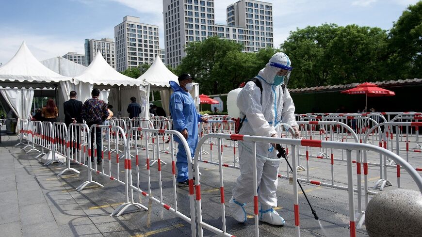 Authorities in China are pursuing a strategy of stamping out the virus entirely, which includes rapid lockdowns and mass testing