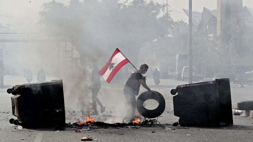 Lebanese protesters block a highway during a protest in the capital Beirut on November 29, 2021, as the country struggles with a deep economic crisis