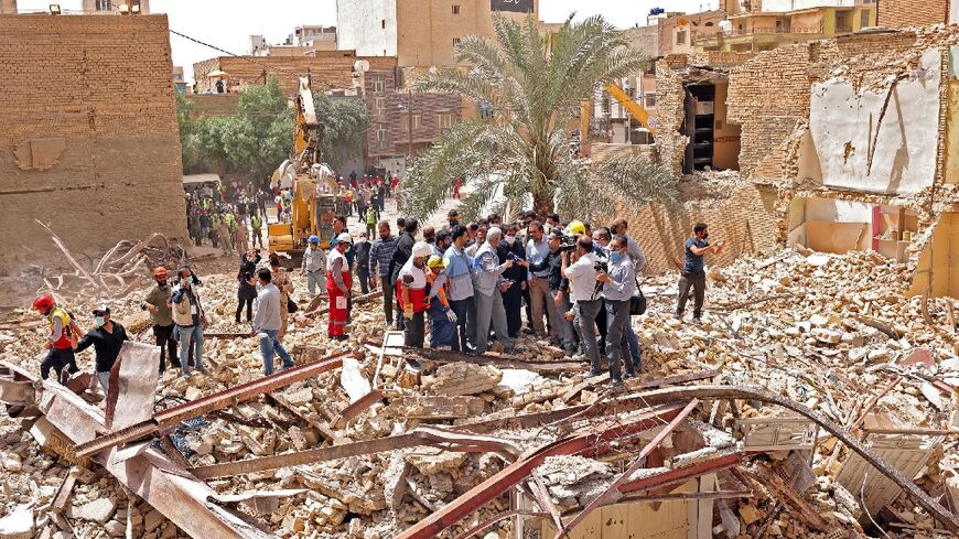 Iranian vice president Mohammad Mokhber tours the site of the tower block collapse which killed at least 26 people in the southwestern city of Abadan