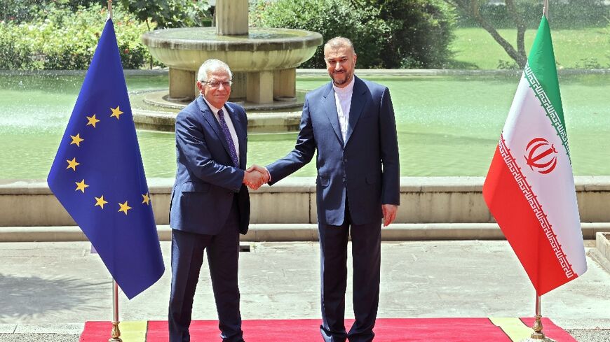 Iran's Foreign Minister Hossein Amir-Abdollahian (R) greets Joseph Borrell, the High Representative of the European Union for Foreign Affairs and Security Policy (L), in Tehran