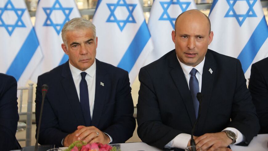 Israeli Prime Minister Naftali Bennett (R) and Foreign Minister Yair Lapid.