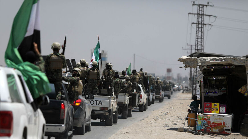 Turkish-backed Syrian rebel fighters are pictured in the border town of Azaz in the rebel-held northern part of the Aleppo province, as they head toward an area facing the Kurdish-controlled town of Tal Rifaat, Syria, June 9, 2022.