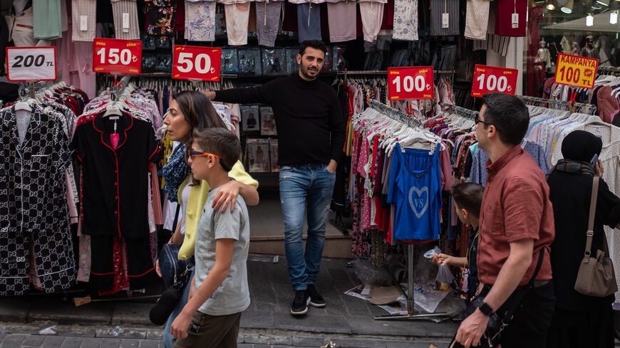 People shop in a street around Istanbul's famous Grand Bazaar on May 05, 2022, in Istanbul, Turkey. 