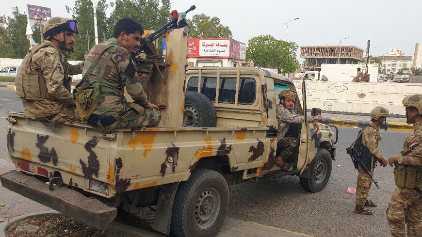 Southern Yemeni fighters  deploy around the site of an explosion in the port city of Aden