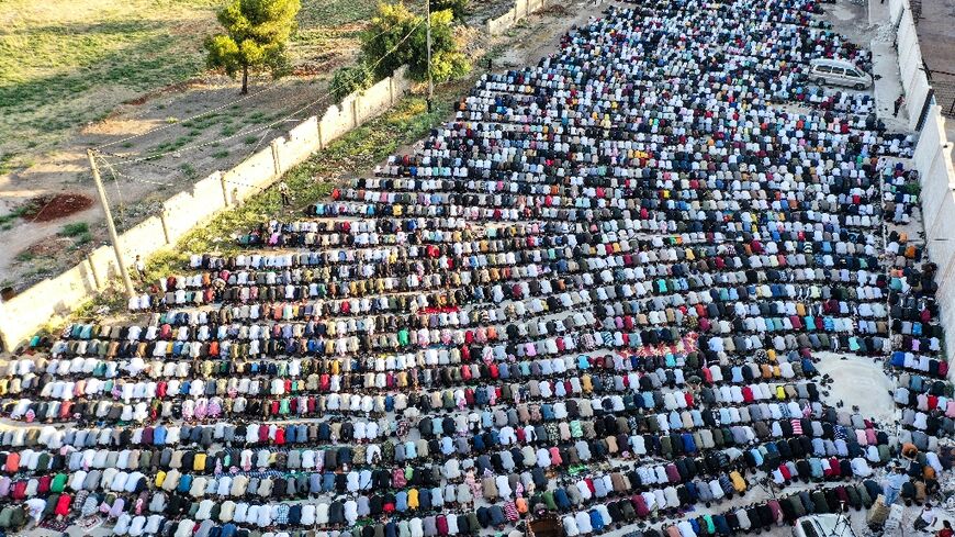 Muslim morning prayers in the rebel-held northwestern Syrian city of Idlib at the start of the Eid al-Adha holidays