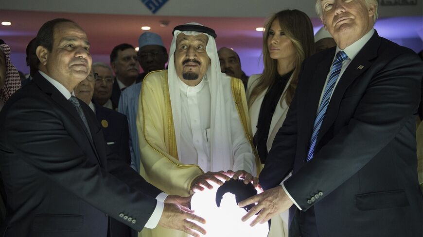 US President Donald Trump (R), Egyptian President Abdel Fattah el-Sisi (L) and Saudi Arabia's King Salman bin Abdulaziz al-Saud pose at the opening of a Riyadh-based centre to combat extremist ideology in May 2017