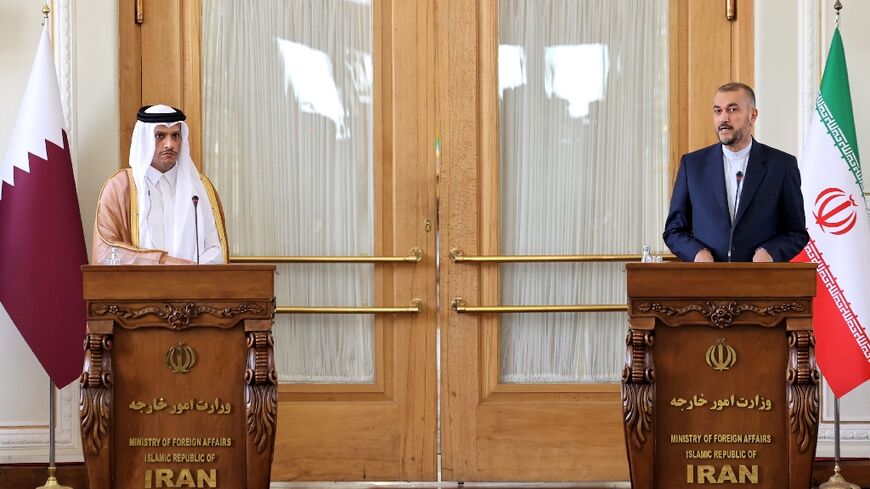 Iran's Foreign Minister Hossein Amir-Abdollahian (R) and Qatar's Foreign Minister Mohammed bin Abdulrahman bin Jassim Al-Thani at a joint press conference in Tehran