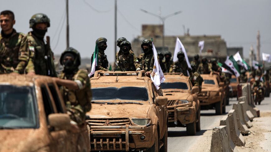 Turkish-backed Syrian rebel fighters are pictured in the border town of Azaz in the rebel-held northern part of Aleppo province.