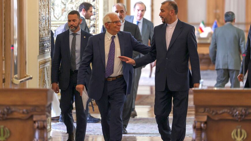 Iran's Foreign Minister Hossein Amir-Abdollahian (R) attends a press conference with Josep Borell.