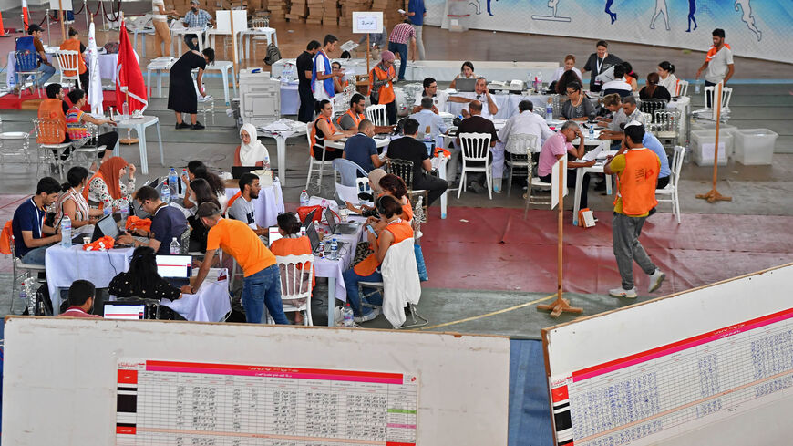 Tunisian electoral officials count votes following a referendum on a new constitution, Tunis, Tunisia, July 26, 2022.