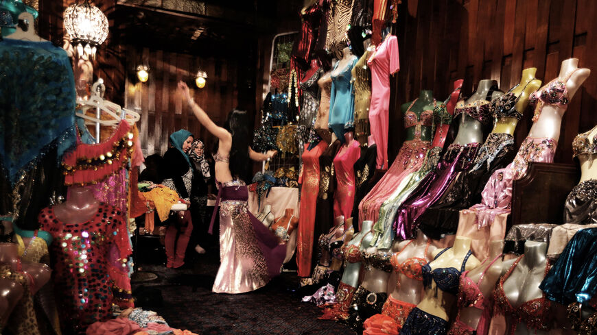 A Chinese dancer warms up before performing at a belly dance school, Cairo, Egypt, Dec. 12, 2012.