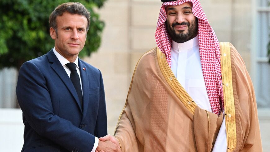 Macron warmly greeted the kingdom's de-facto ruler ahead of a dinner, defying objections from activists