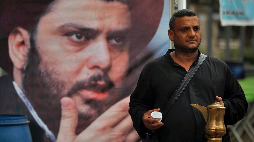 Volunteers distribute food to supporters of Iraqi Shiite cleric Moqtada Sadr during a protest outside the Iraqi parliament in Baghdad's Green Zone on August 16, 2022