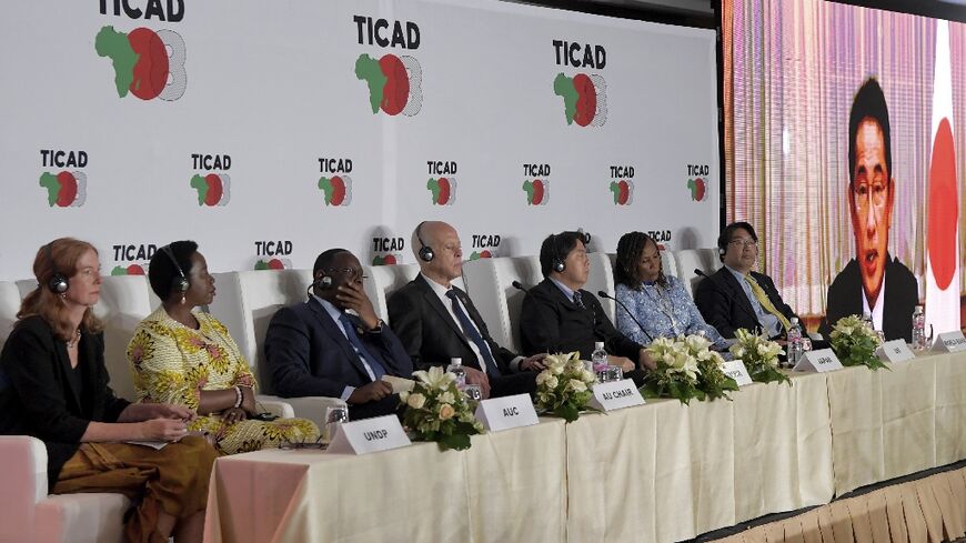 Japan's Prime Minister Fumio Kishida joins by video conference a press conference at the Tokyo International Conference on African Development (TICAD) in Tunisia