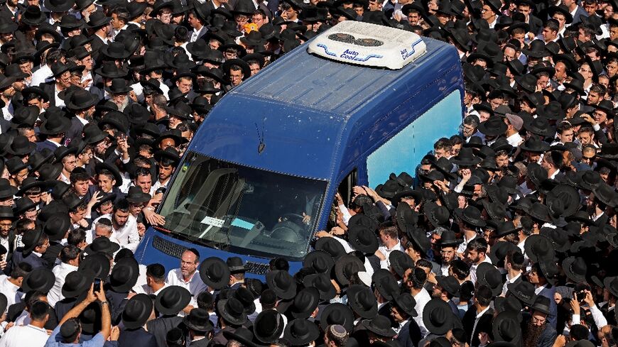 Thousands of ultra-Orthodox Jews attend the funeral in Jerusalem of Rabbi Shalom Cohen, spiritual leader of Israel's largest ultra-Orthodox Shas political party