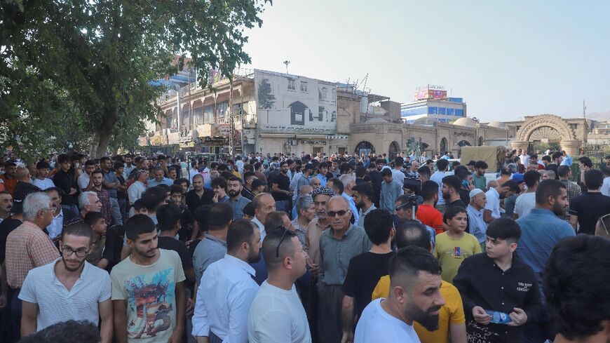 People gather for a rally called for by the New Generation Kurdish opposition party in Iraq's northeastern city of Sulaimaniyah in the autonomous Kurdistan region