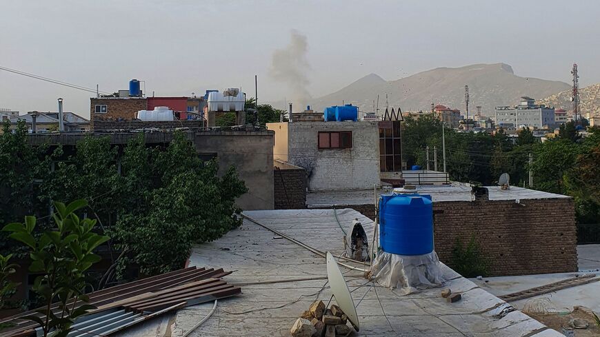 In this photograph taken on July 31, 2022, smoke rises from a house following a US drone strike in the Sherpur area of Kabul.