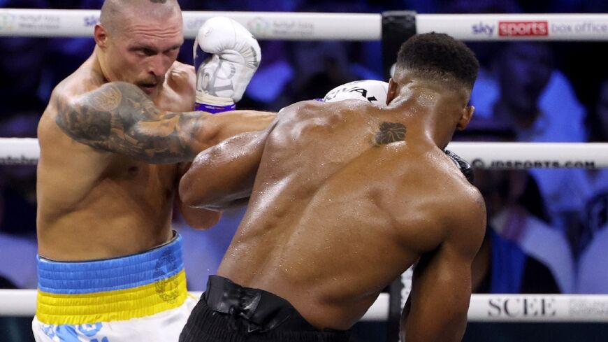 On top again: Ukraine's Oleksandr Usyk (left) defeats Britain's Anthony Joshua 