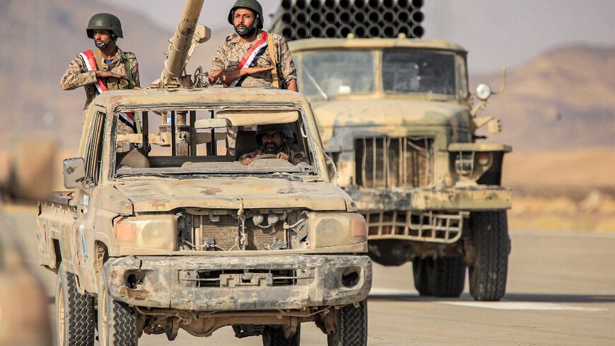 Yemenin pro-government forces take part in a parade in June: rival forces have been observing a fragile truce since April