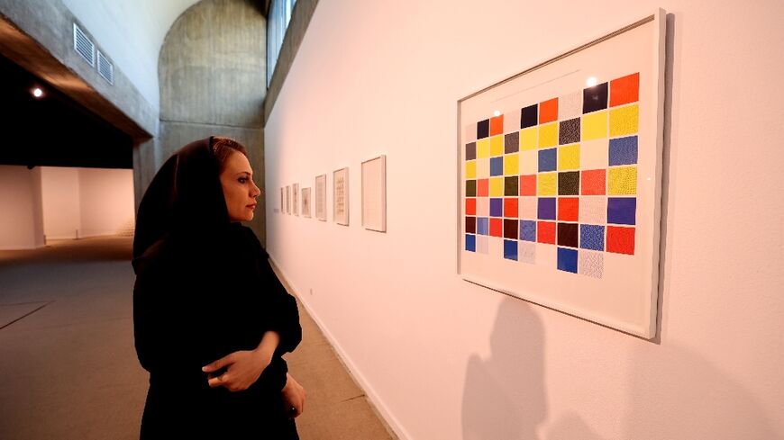 Visitors look at artwork by American artist Sol LeWitt at the Tehran Museum of Contemporary Art: the museum's collection is reputed to be the greatest line-up of modern masterpieces outside Europe and the United States