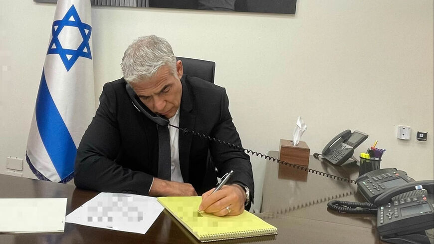 Israeli Prime Minister Yair Lapid on the phone with French President Emmanuel Macron, Jerusalem, Aug. 22 2022.