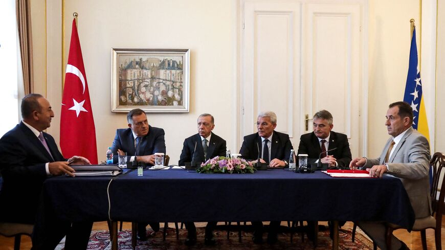 (From L-R) Turkey's President Recep Tayyip Erdogan (3rd-L) and Foreign Minister Mevlut Cavusoglu (L) attend a meeting with members of Bosnia and Herzegovina's tripartite presidency Sefik Dzaferovic (3rd-R), Milorad Dodik (2nd-L) and Zeljko Komsic (2nd R) and Bosnian Security Minister Selmo Cikotic (R) in Sarajevo on Sept. 6, 2022.