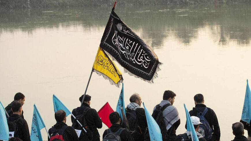 Shiite Muslim pilgrims march toward Iraq's holy city of Karbala to attend the Arbaeen religious commemoration.