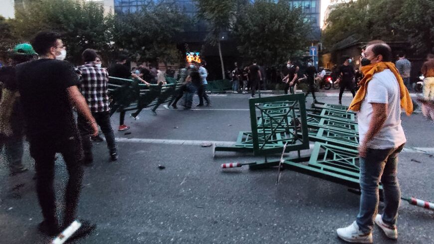 A picture obtained by AFP outside Iran on Sept. 21, 2022, shows Iranian demonstrators taking to the streets of the capital Tehran during a protest for Mahsa Amini, days after she died in police custody. 