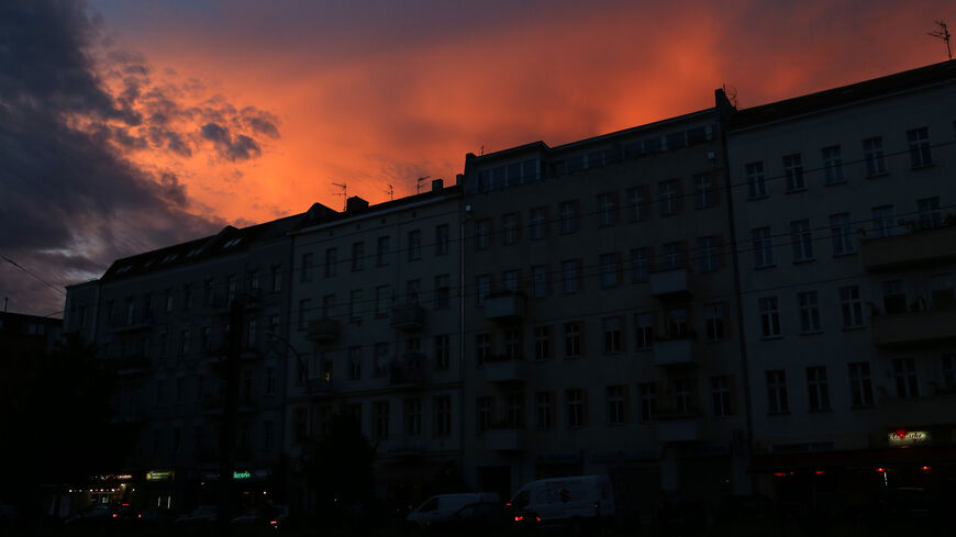 Residential buildings are seen unilluminated in the evening on Sept. 10, 2022, in Berlin, Germany. 