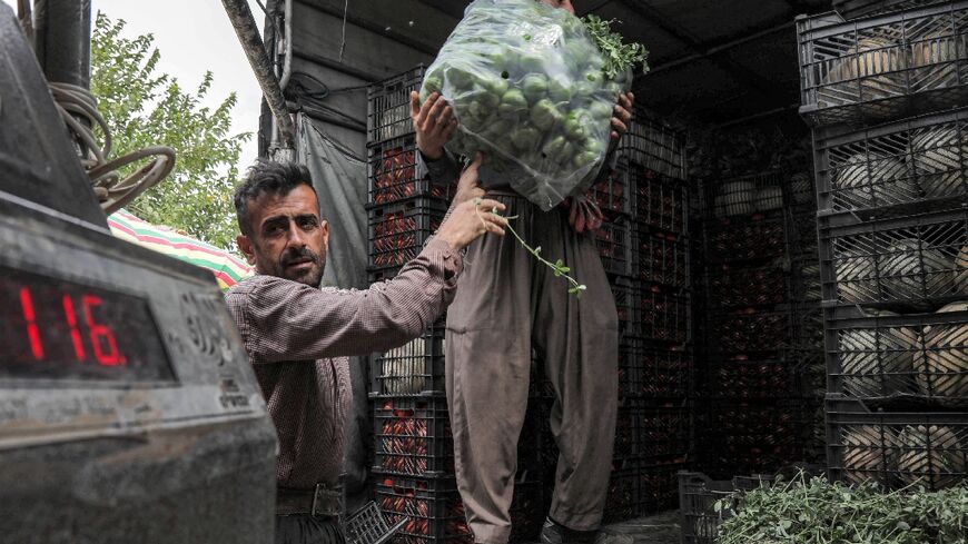 Iranian Kurdish men working in neighbouring Iraq's northern Kurdistan region: the two areas have close ties