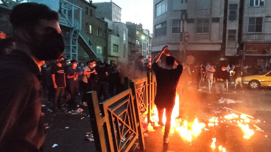 A picture obtained by AFP outside Iran shows demonstrators on the streets of Tehran as protests over the death of young woman in morality police custody spread to cities nationwide