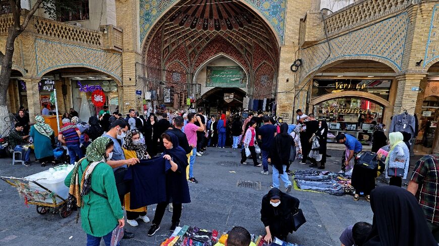 Iranian women shop at the Grand Bazaar in the capital Tehran on September 28