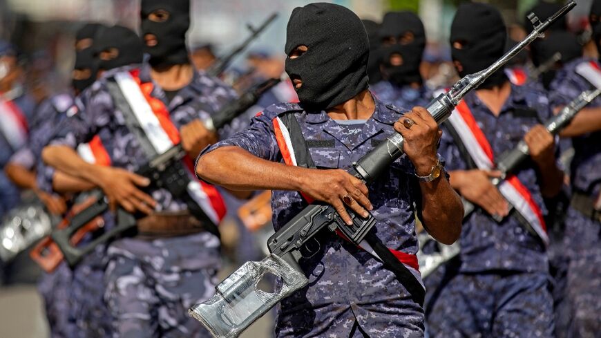 Yemeni government security forces take part in a military parade in the third city of Taez on September 26 