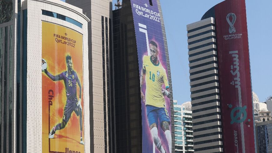 Banners on buildings in the Qatari capital Doha show Neymar and other World Cup stars