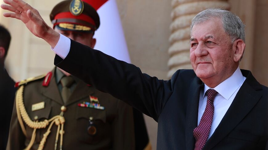 Iraq's newly-elected President Abdul Latif Rashid waves during his inauguration and handover ceremony at al-Salam Palace in the capital Baghdad