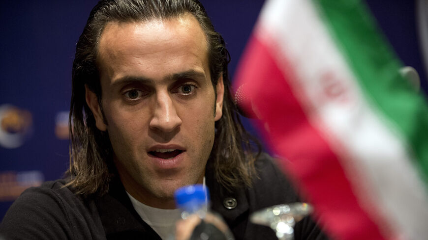 Mohammad Ali Karimi, a nominee for AFC Player of the Year, speaks at a press conference in Kuala Lumpur, Malaysia, Nov. 28, 2012.