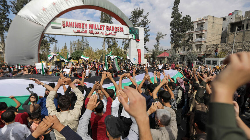 Syrian demonstrators gather to protest Hayat Tahrir al-Sham in the opposition-held city of al-Bab, on the border with Turkey, Aleppo province, Syria, Oct. 21, 2022.