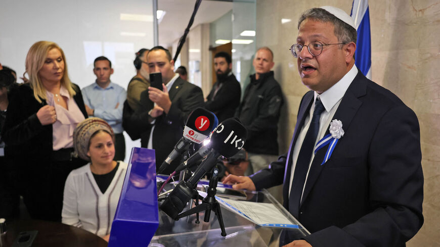 Israeli Knesset member Itamar Ben-Gvir delivers a speech next to his wife Ayala (bottom L) at the Knesset, before a swearing-in ceremony for new members of parliament, Jerusalem, Nov. 15, 2022.