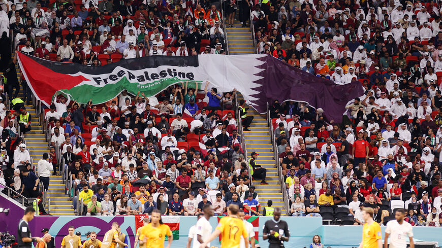 Fans hold up a banner reading "Free Palestine" during the FIFA World Cup Qatar 2022 Group A match between Netherlands and Qatar at Al Bayt Stadium on November 29, 2022 in Al Khor, Qatar.