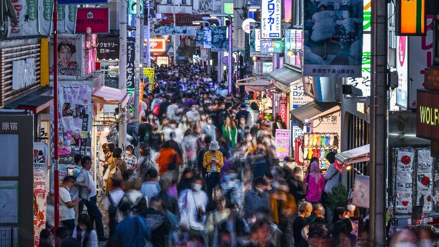 People walking down Takeshita Street in the Harajuku area of Tokyo, a popular shopping district