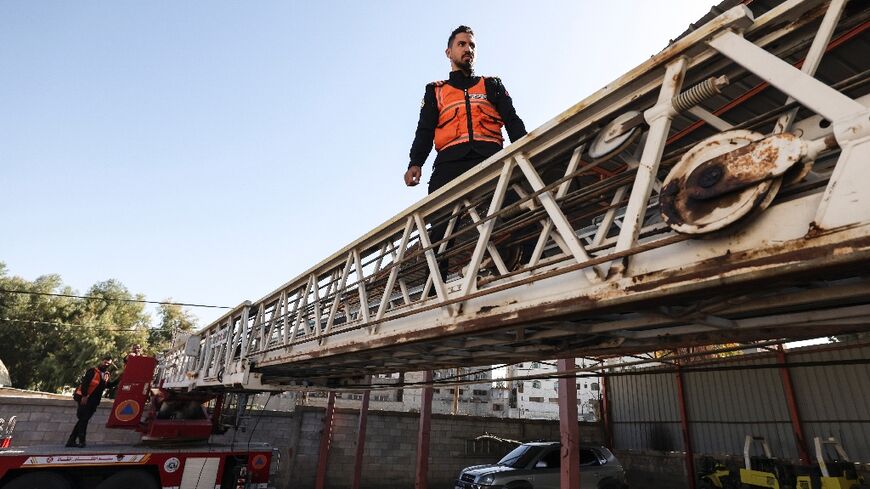 Palestinian firefighters check equipment at Gaza City's civil defence headquarters -- 'Everything is old and worn out,' the unit's chief said