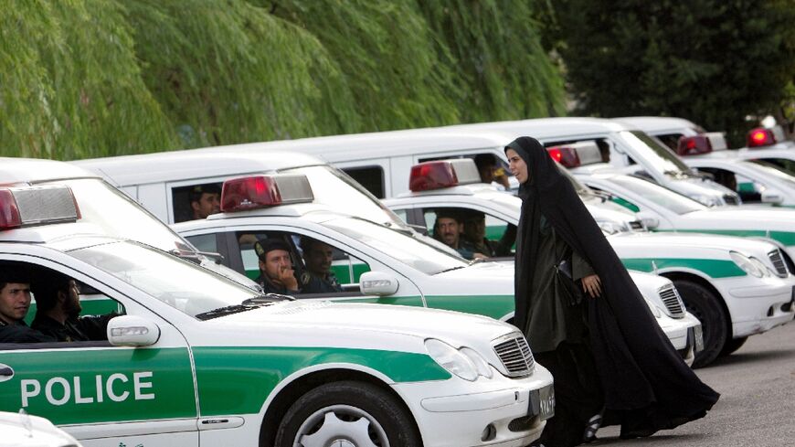 The morality police squads were usually made up of men in green uniforms and women clad in black chadors