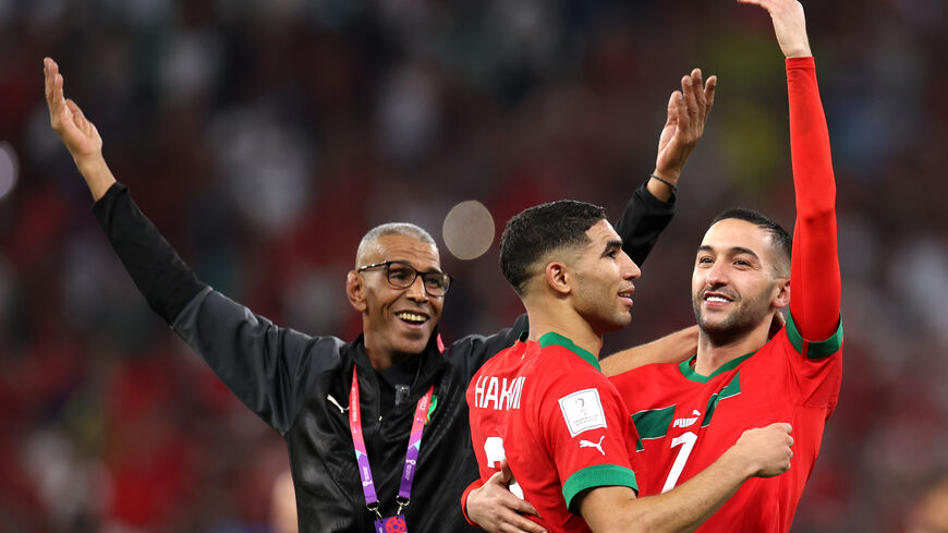 Achraf Hakimi and Hakim Ziyech of Morocco celebrate after the team's victory during the FIFA World Cup Qatar 2022 quarter final match between Morocco and Portugal at Al Thumama Stadium on December 10, 2022 in Doha, Qatar. (Photo by Francois Nel/Getty Images)